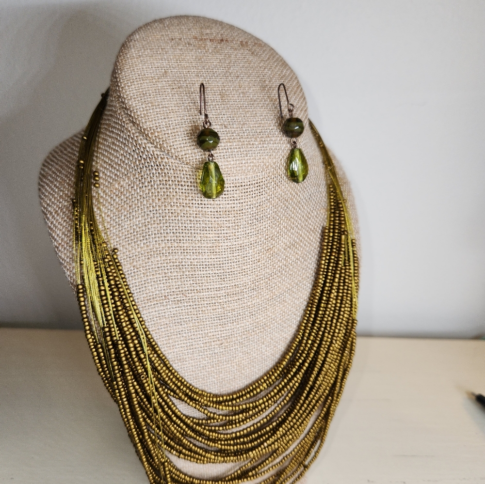 Vintage gold beaded bib necklace paired with green beaded dangle earrings!